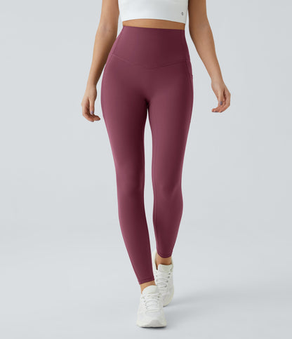 Front view of Celeste L'Amour Evening Red high-waisted 7/8 leggings shown on a model mid-stride