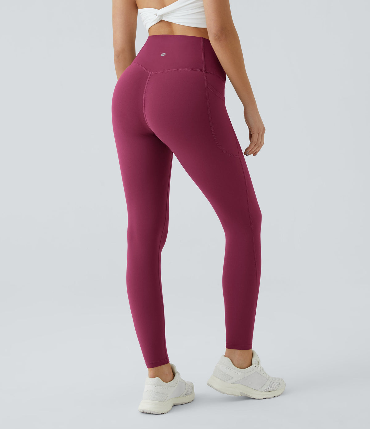 Three-quarter back view of Celeste L'Amour Red Plum high-waisted leggings showing the scrunch back seam