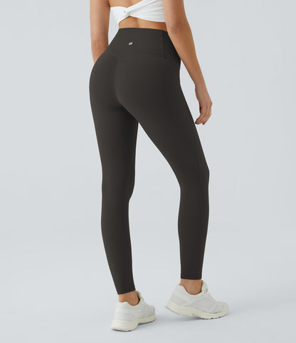 Three-quarter back view of Celeste L'Amour Hazelnut Black high-waisted leggings showing the scrunch back seam