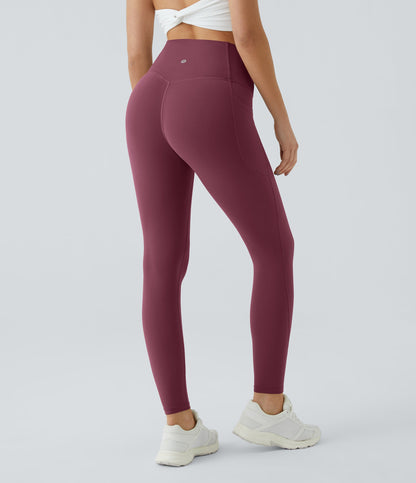 Three-quarter back view of Celeste L'Amour Evening Red high-waisted leggings showing the scrunch back seam